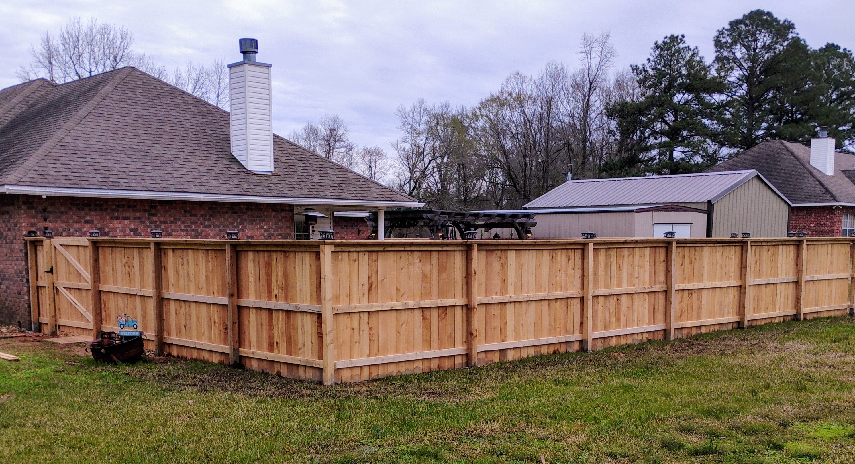 Cedar privacy fence installation – Fortified Fence and Weld