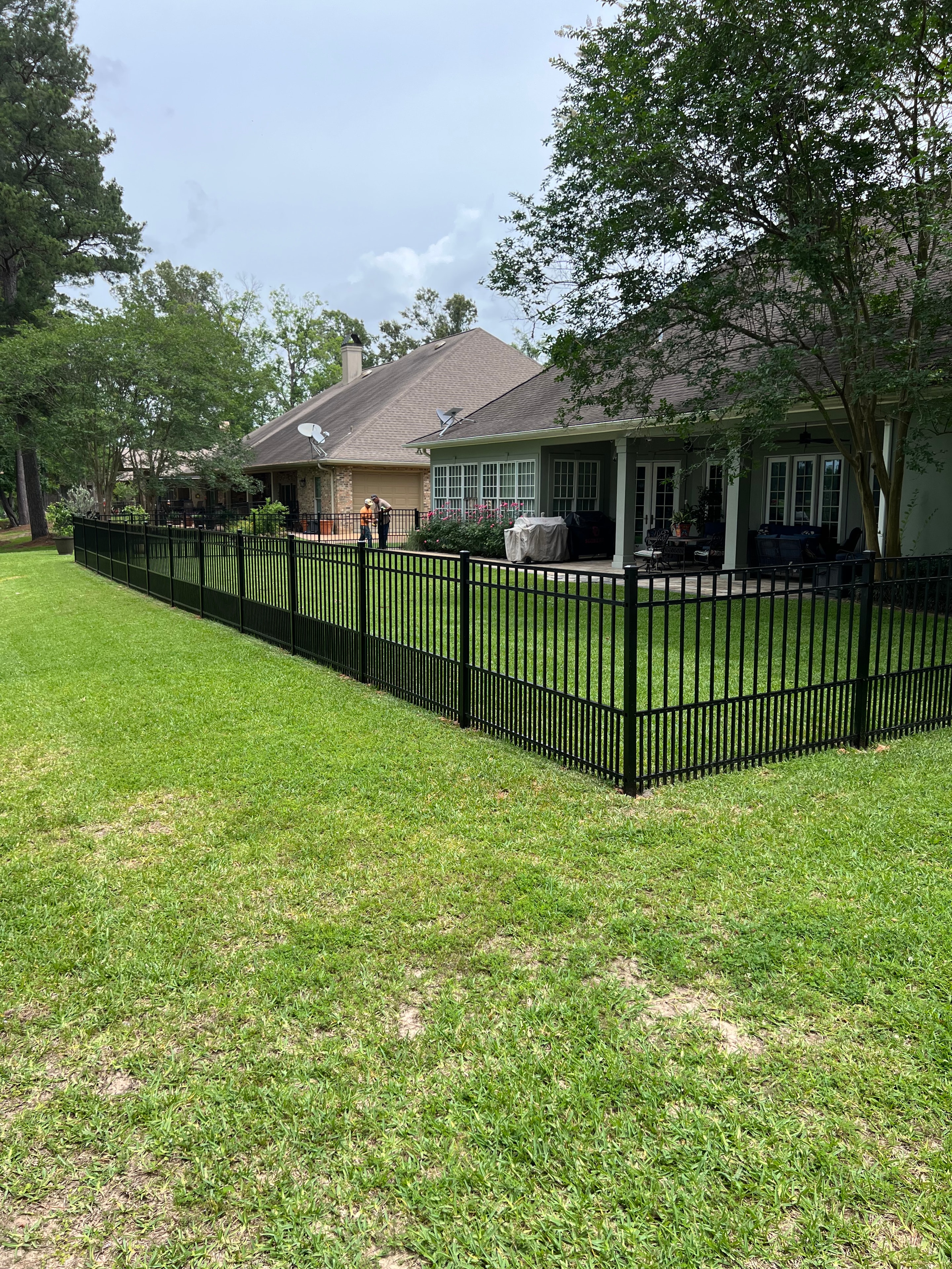 Fully fenced residential yard in Alexandria, LA – Fortified Fence and Weld