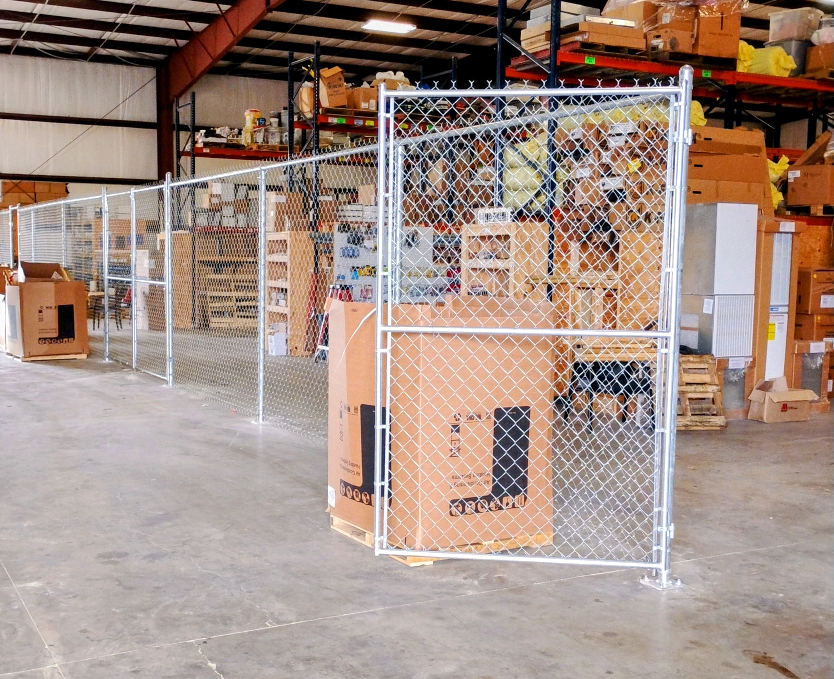 Commercial chain link partition fence with gate installed inside warehouse – Fortified Fence and Weld, Louisiana