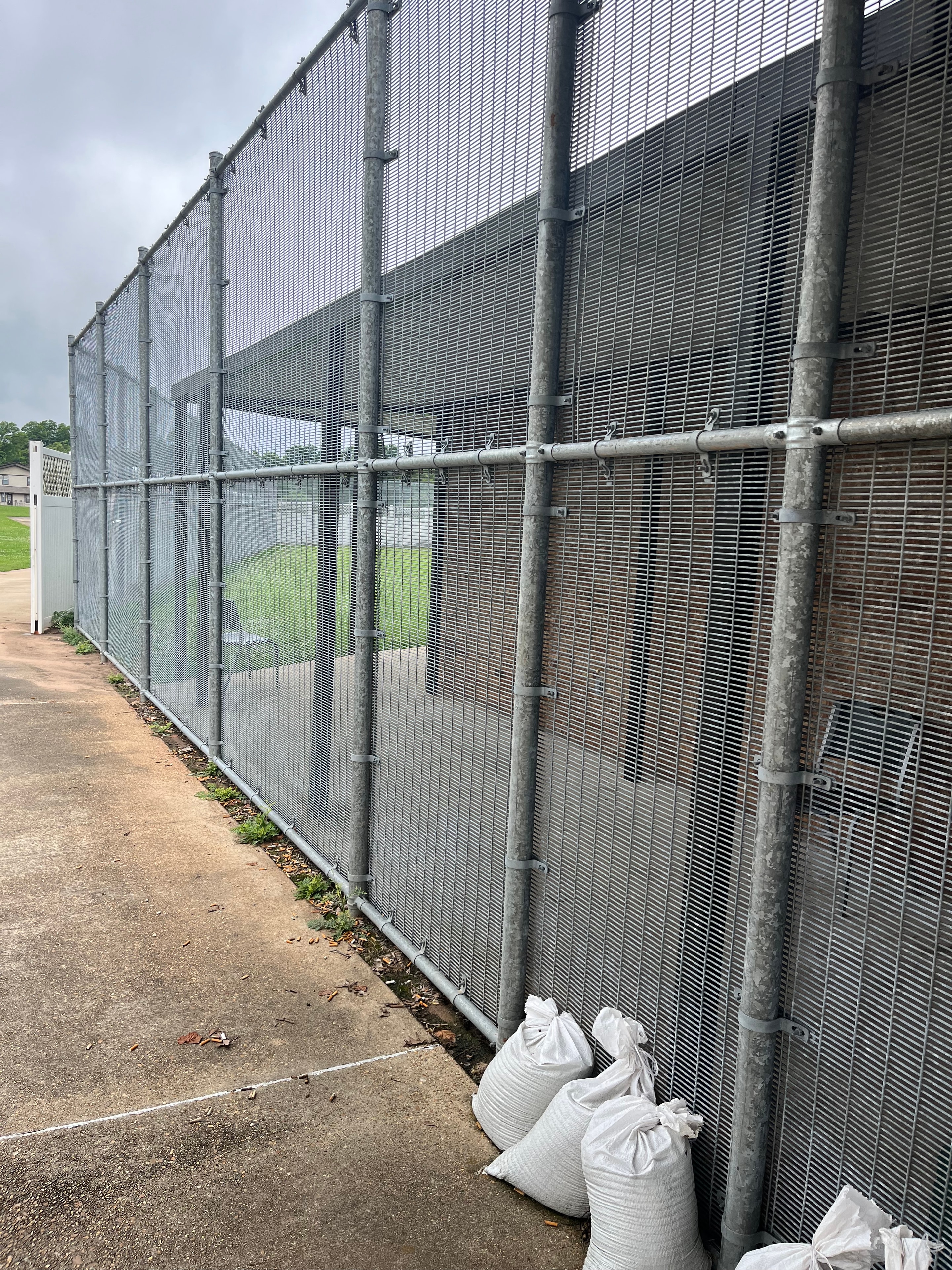 Heavy-gauge welded wire mesh security fence with galvanized steel posts installed at commercial facility in Central Louisiana – Fortified Fence and Weld