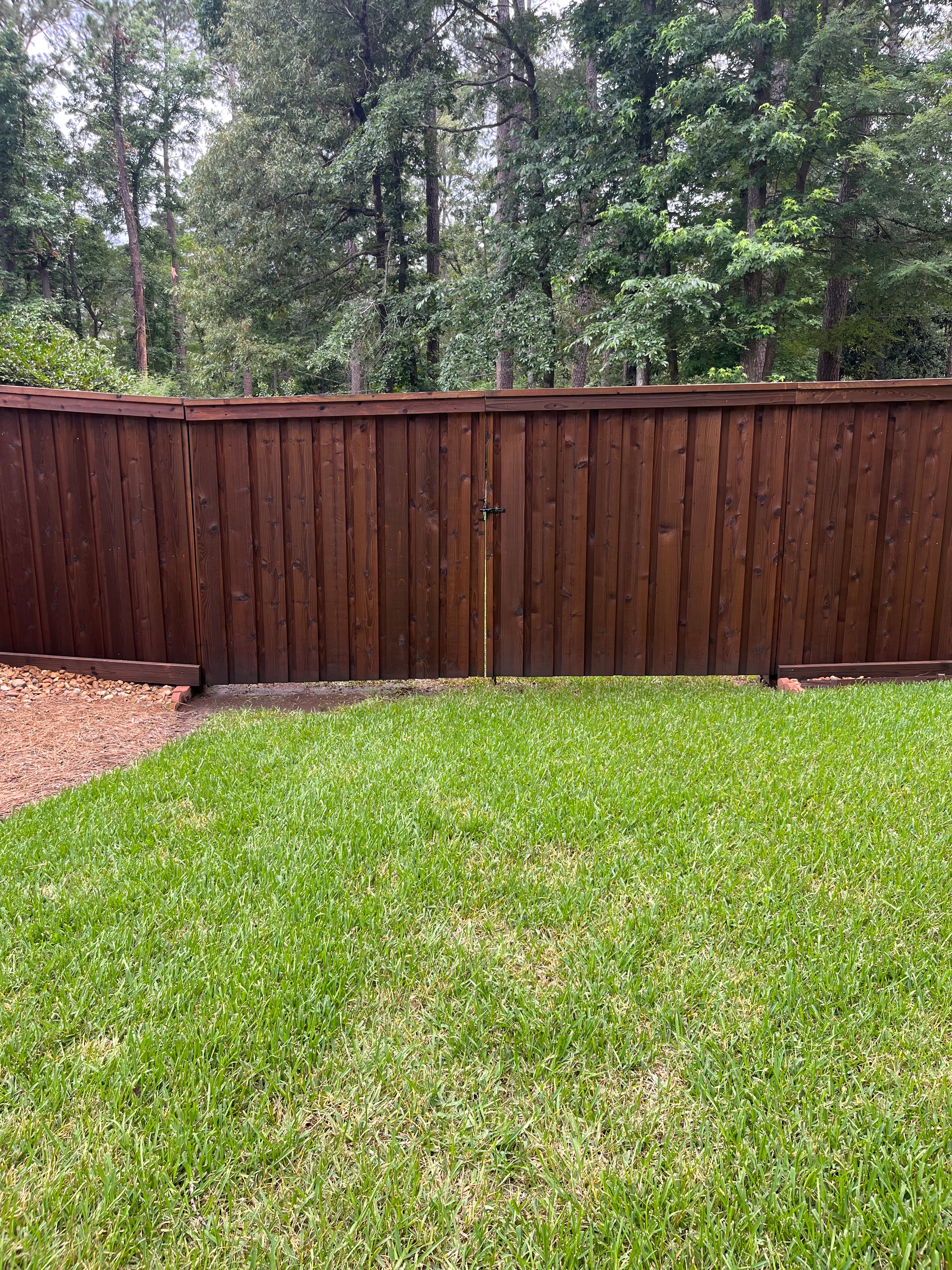Cedar wood privacy fence gate latch side — horizontal board fence with steel frame in Alexandria, LA – Fortified Fence and Weld