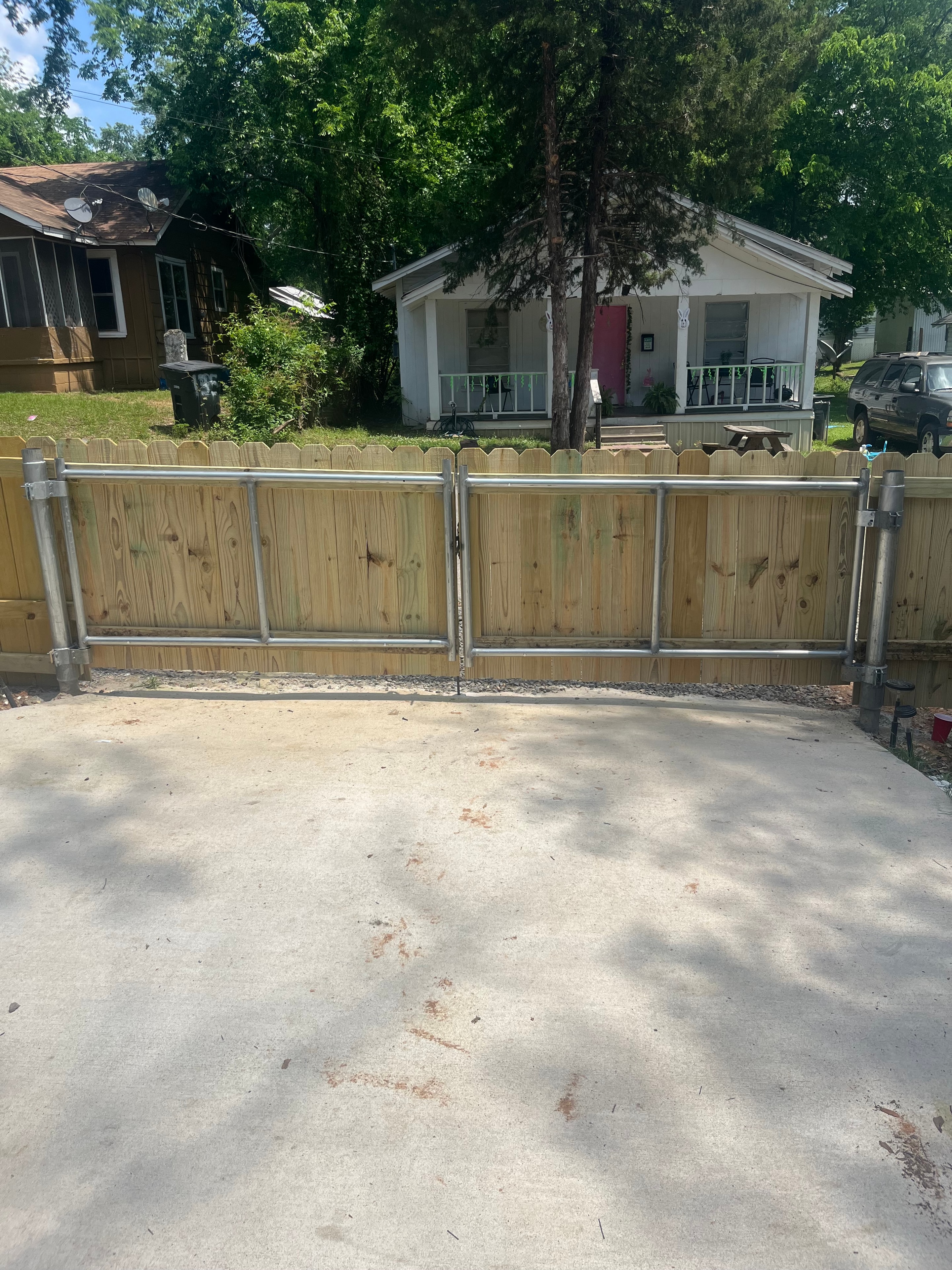 Automatic wood privacy sliding gate with steel frame installed at residential property — Fortified Fence and Weld, Alexandria LA